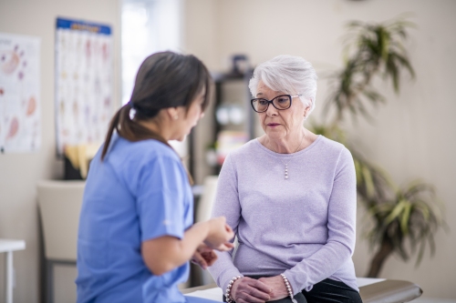 Medical professional talking to patient